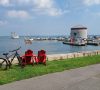 Picture of a bicycle and two chairs looking over a bay
