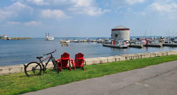 Picture of a bicycle and two chairs looking over a bay